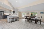 Open concept kitchen and dining room with vaulted ceilings